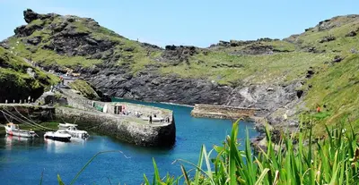 a body of water with boats in the water at Kiberick Cottage at Crackington Haven, near Bude and Boscastle, Cornwall in Bude