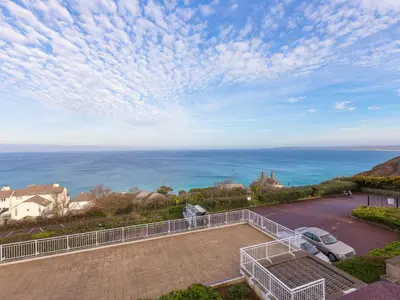 a view of the ocean from the balcony of a house at Laurellie in Carbis Bay