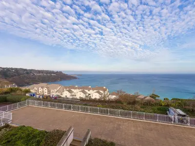 a view of the ocean from a house at Laurellie in Carbis Bay
