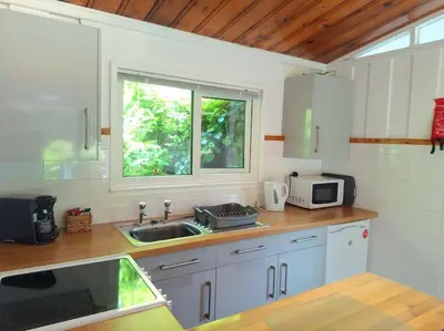 a kitchen with a sink and a window at Bantry Cottage at Crackington Haven, near Bude and Boscastle, Cornwall in Bude