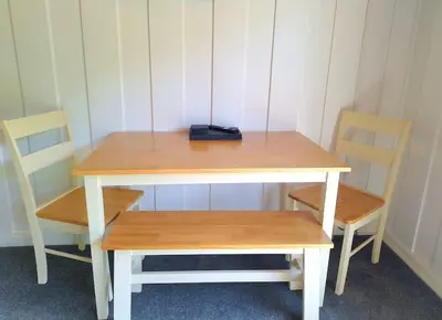 a desk with two chairs and a table at Bantry Cottage at Crackington Haven, near Bude and Boscastle, Cornwall in Bude