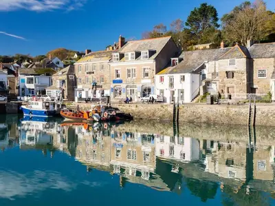 a harbor with boats in the water next to houses at Kallowen Cottage at Crackington Haven, near Bude and Boscastle, Cornwall in Bude