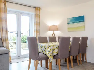 a dining room with a table and chairs at Atlantic Reach in Marazion
