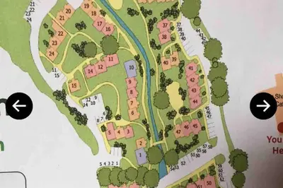 a map of a park with two arrows pointing to at Stunning Holiday home with amazing surroundings! in Budock Water
