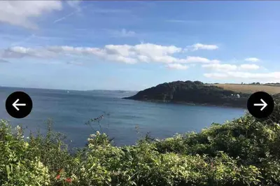 a view of a body of water with two arrows at Stunning Holiday home with amazing surroundings! in Budock Water