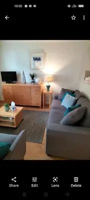 a living room with a couch and a table at Stunning Holiday home with amazing surroundings! in Budock Water