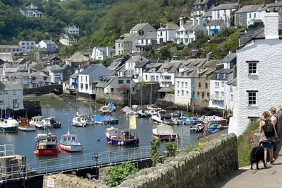 a group of boats docked in a harbor with houses at Cargibbitt Annexe in Liskeard
