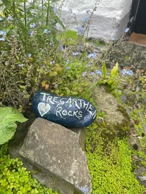 a rock with the words fire extinguishing rocks written on it at Cosy Cottage Central Marazion with Parking in Marazion