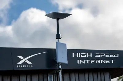 a street light next to a high speed internet sign at Luxury Shepherd's Hut on Meadow with Outdoor Bath in Mid Cornwall in Truro