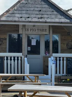 a picnic bench in front of a fire truck at Mawgan Stays Mawgan Porth in Mawgan Porth