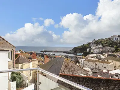 a view of a city with the ocean in the background at Chy An Mor in Mevagissey