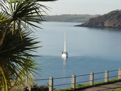 a sailboat floating in a large body of water at Membly Hall Hotel in Falmouth