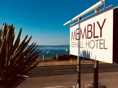 a sign for a hotel on the side of a road at Membly Hall Hotel in Falmouth