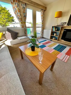 a living room with a coffee table and a couch at Newquay Bay Resort - Summer Days 135 in Porth