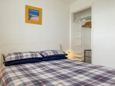 a bedroom with a bed with two pillows on it at Zephyr's View in Poundstock