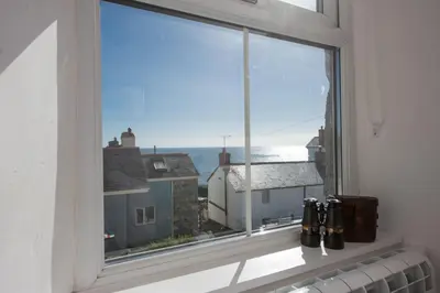 a window with a view of the ocean at Rosevean in Marazion