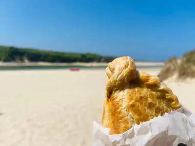a piece of food sitting on top of a beach at Oceano - Carbis bay, St Ives, 1 bed apartment with free parking near to the beach in St Ives