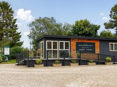a small building with plants in front of it at 5 Faraway Fields in Liskeard
