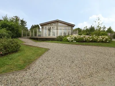 a house with a gravel path leading to a house at 11 Faraway Fields in Liskeard