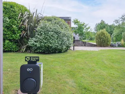 a yard with a pay phone in the grass at 1 Horizon View in Liskeard
