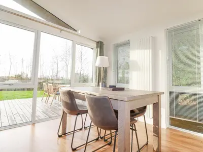 a dining room with a table and chairs at 14 Horizon View in Liskeard