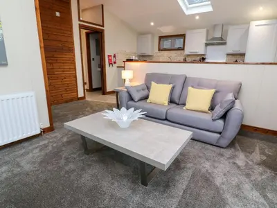 a living room with a couch and a coffee table at 2 Southern Place in Liskeard