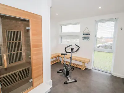 a gym with a exercise bike in a room at 1 Southern Place in Liskeard
