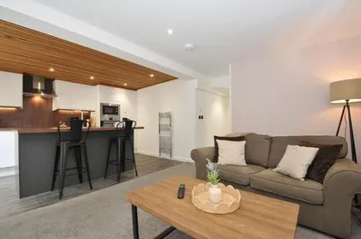 a living room with a couch and a table at 24 Meadow Retreat in Liskeard