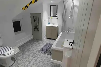 a bathroom with a toilet and a shower and a sink at Willow Cottage Cosy Cornish Rural Retreat - Dog Friendly Cornwall in Ponsanooth