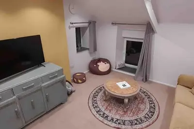 a living room with a tv and a coffee table at Willow Cottage Cosy Cornish Rural Retreat - Dog Friendly Cornwall in Ponsanooth