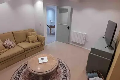 a living room with a couch and a table at Willow Cottage Cosy Cornish Rural Retreat - Dog Friendly Cornwall in Ponsanooth