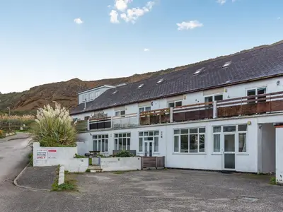 a large white building with a lot of windows at Mortreth in Porthtowan