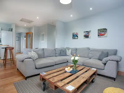 a living room with a couch and a coffee table at Semybadazee in Poundstock