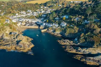 an aerial view of a river with a town at Bijou Coastal Apartment in Polperro With Hot Tub, Onsite Parking 5 min Downhill Walk To Village in Polperro