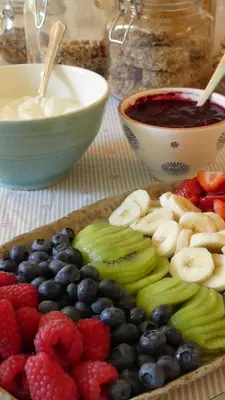 a plate of fruits and vegetables on a table at Higher Trenear Farm B&B in Helston