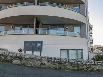a building with a sign in front of it at Fistral Retreat in Newquay