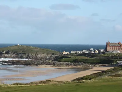 a view of the beach with a hotel in the background at Fistral Retreat in Newquay