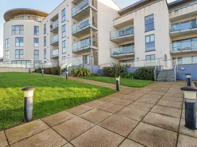 a walkway in front of a building at Fistral Retreat in Newquay