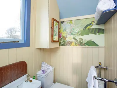 a bathroom with a toilet and a painting on the wall at The Tabernacle-Uk41753 in Lanreath
