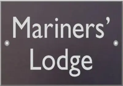 a sign with the words mariners lodge on it at Mariners Lodge in Saint Minver