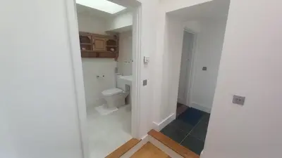 a bathroom with a toilet and a sink at Quayside in Porthscatho