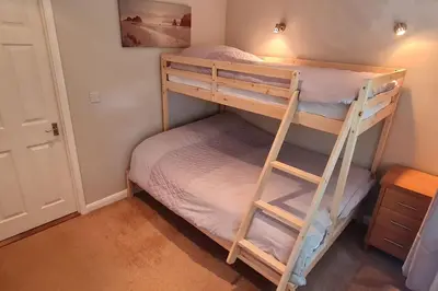 a couple of bunk beds in a room at Cornish Point in Newquay