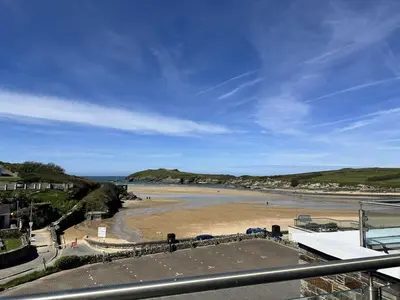 a view of a beach with people on the sand at 5 The Beach House in Saint Columb Minor