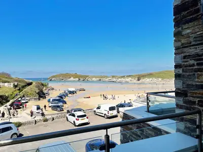 a view of a beach with cars parked in a parking lot at 5 The Beach House in Saint Columb Minor
