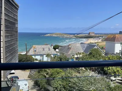 a view of the ocean from the balcony of a house at 33 Ocean one in Newquay