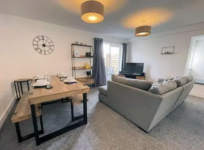 a living room with a couch and a table at 33 Ocean one in Newquay