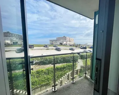 a balcony with a view of a parking lot at 38 Zinc in Newquay