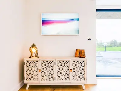 a white cabinet in a room with a window at The Farmhouse - within the Helland Barton Farm collection in Delabole