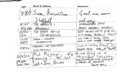 a handwritten document with handwriting on a sheet of paper at Inviting Traditional Fishermens cottage in the heart of the village, close to the harbour in Mevagissey