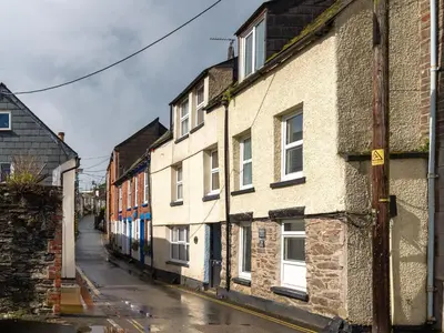 a row of buildings on a city street at Inviting Traditional Fishermens cottage in the heart of the village, close to the harbour in Mevagissey
